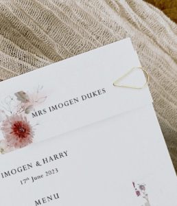 Dahlia wedding menu with paperclip place card
