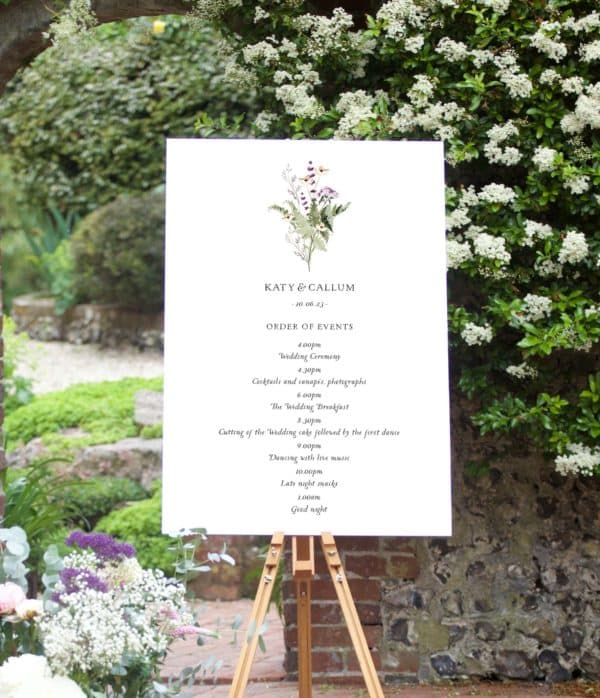 meadow sweet wedding order of events sign with wild flowers