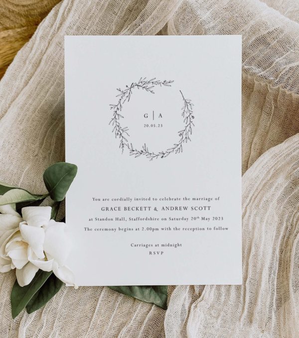 delicate wedding invitation with monogram