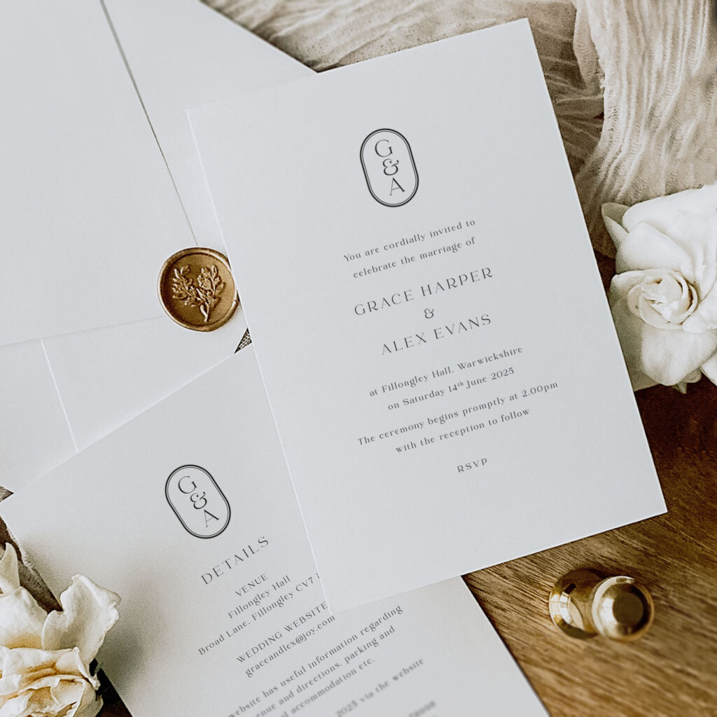 Monogram simple elegant wedding invitation on wooden background