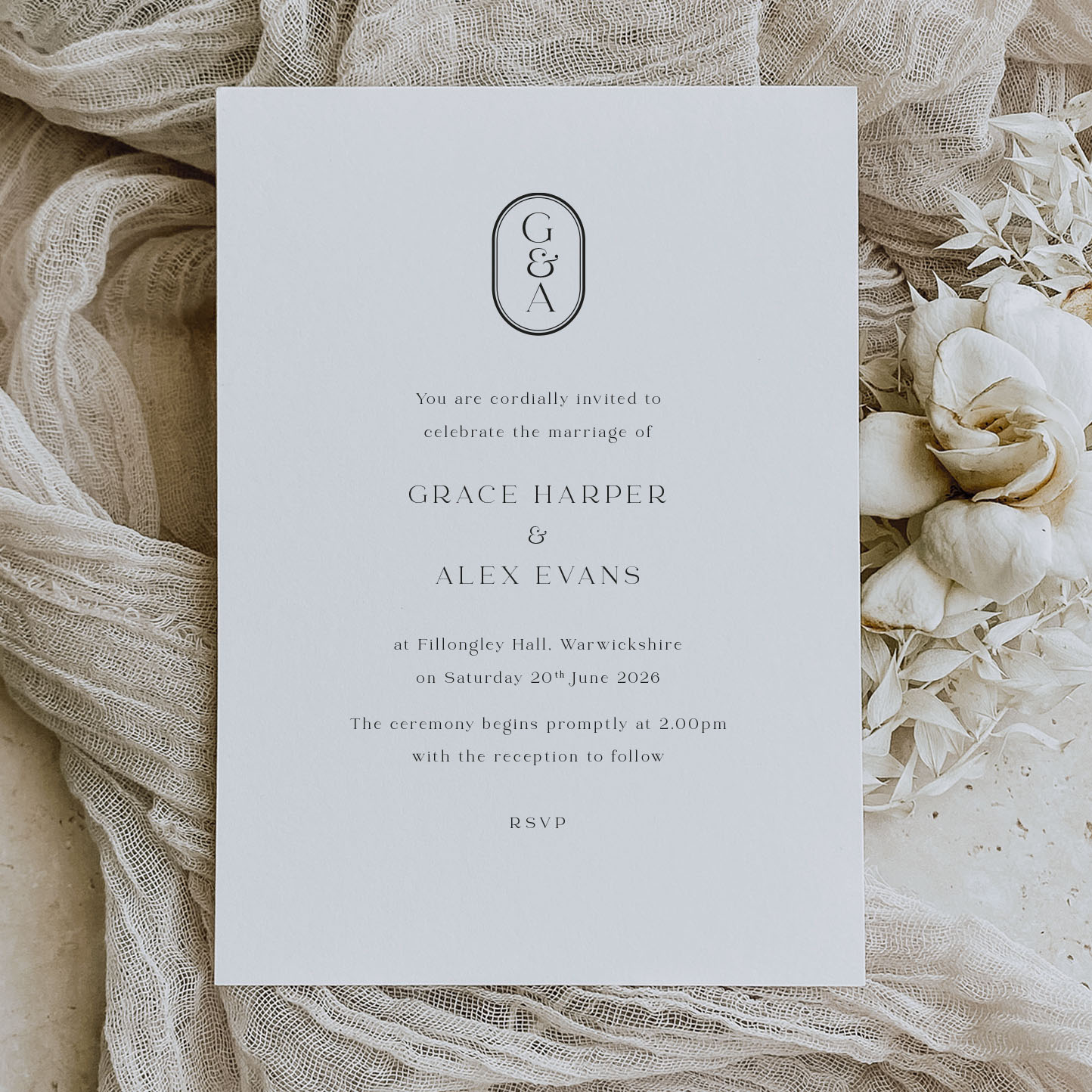 showing Grace - simple elegant monogram wedding invitation on a cream background