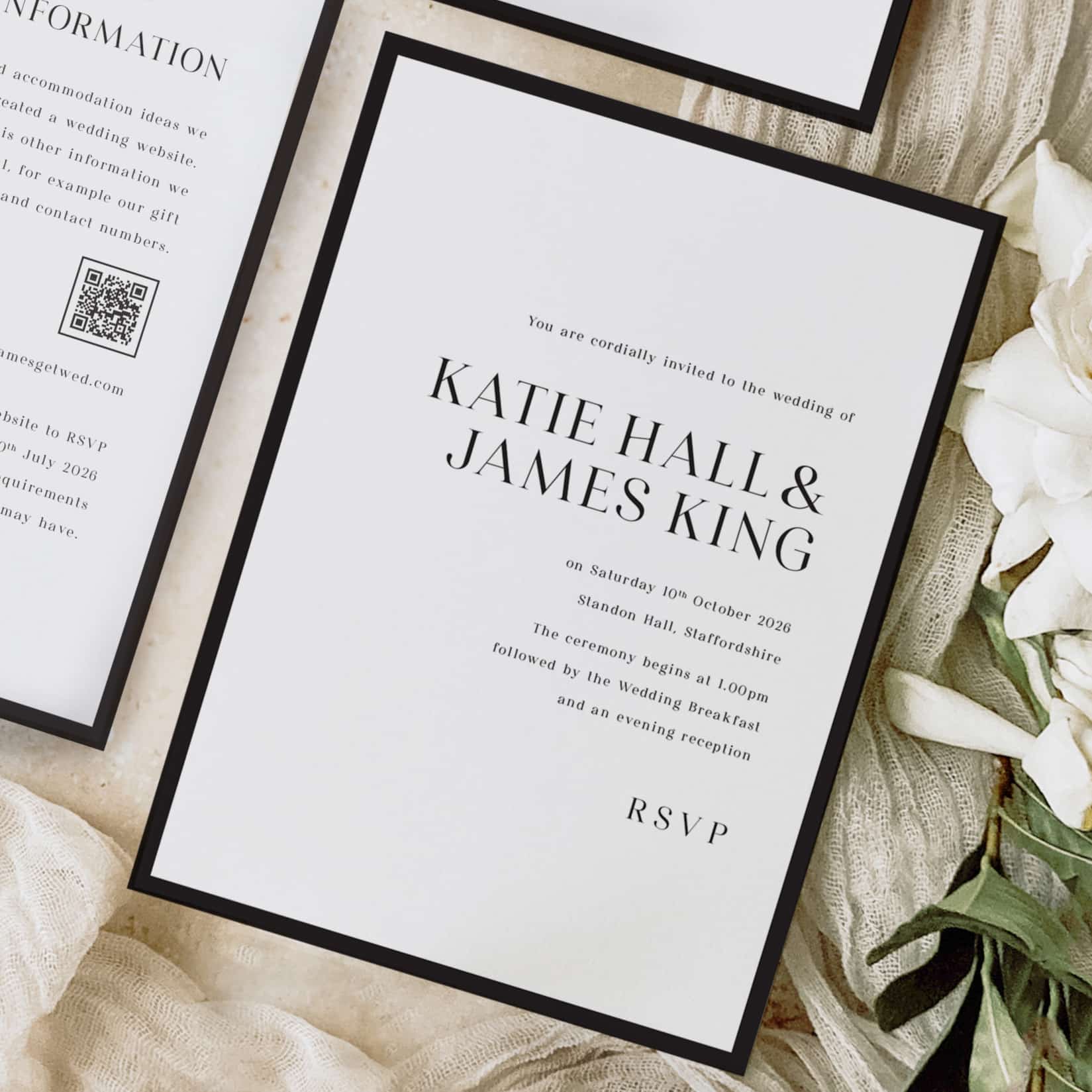 showing modern wedding stationery collection, boredr. it's a black and white wedding stationery design, with striking black font. it's a white card on a pale linen background