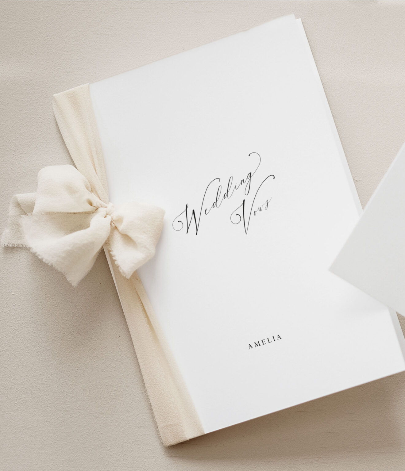 wedding vow book personalised with your words, shown with a cream chiffon ribbon