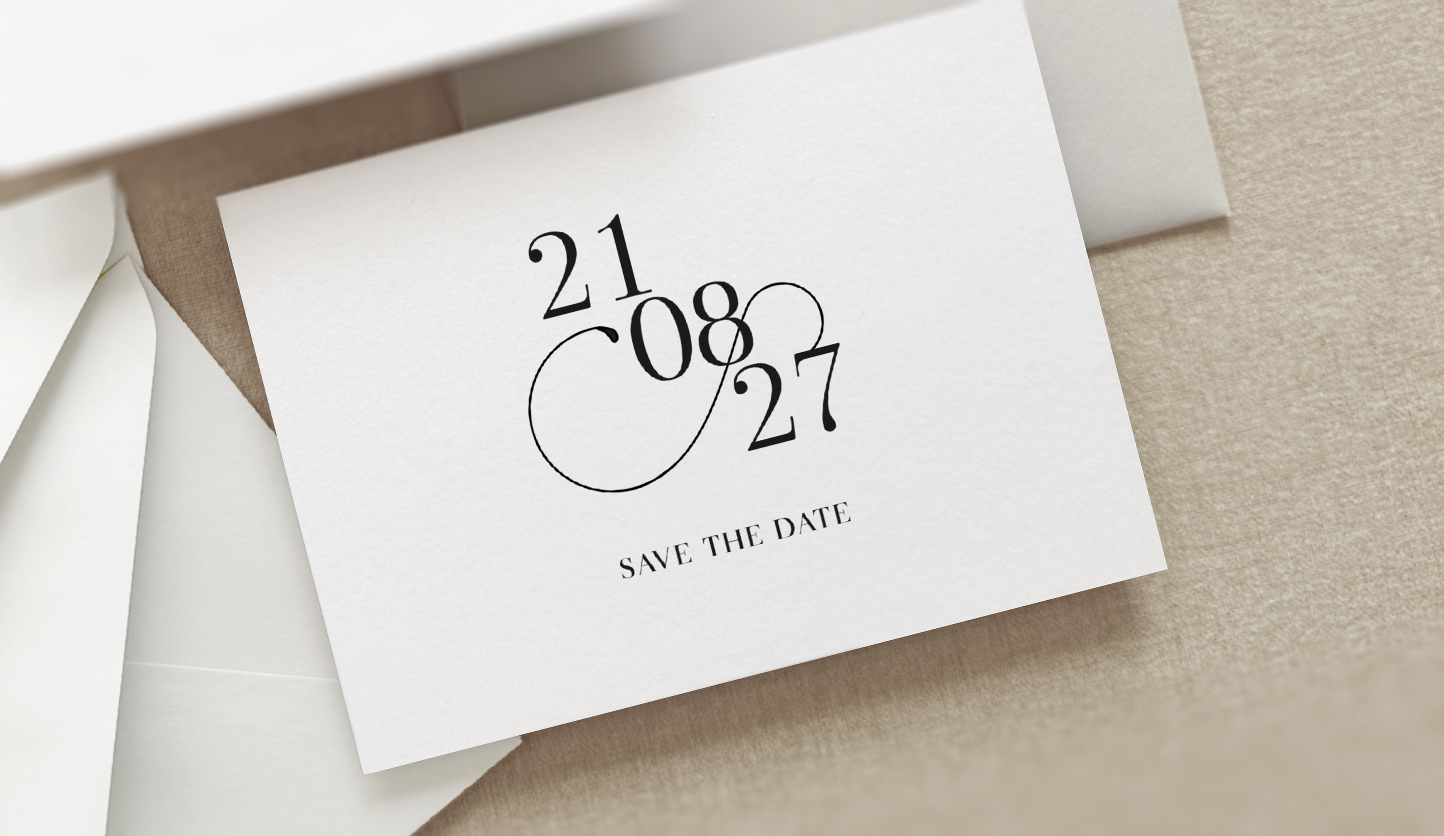 modern simple wedding save the date card shown on a beige background